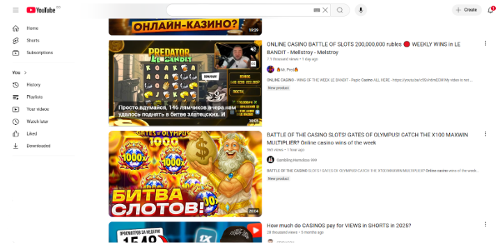 Скриншот страницы YouTube с видео на тему онлайн-казино и арбитража. Видны видеоролики с названиями вроде “ONLINE CASINO BATTLE OF SLOTS 200,000,000 rubles” и “BATTLE OF THE CASINO SLOTS: GATES OF OLYMPUS”, а также обложки с яркими изображениями игровых автоматов, монет и персонажей. Видео посвящены слотам, казино-битвам и обзорам доходов.
